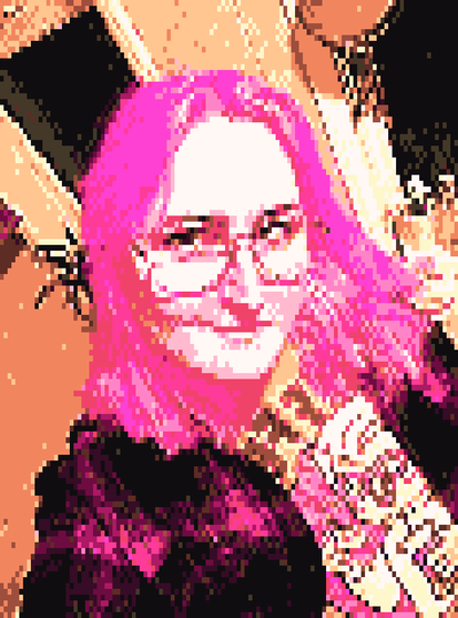 a picture of a woman with pink hair and glasses, heavily compressed in resolution and palette giving it a very blocky look