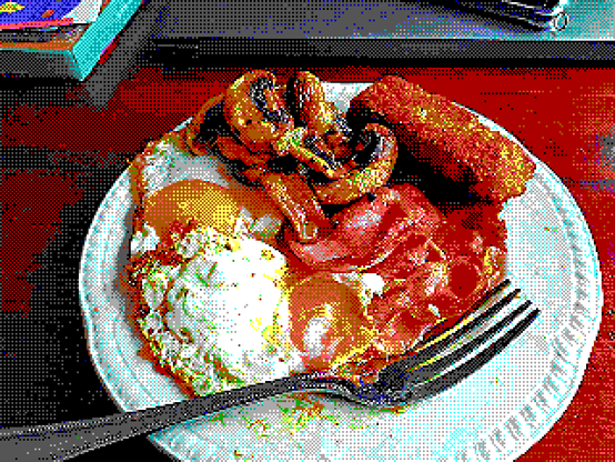 a picture of a meal of eggs, bacon, hashbrowns and mushrooms, dithered into a 16-color EGA palette