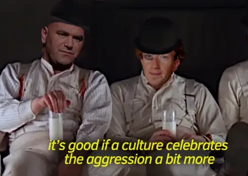 iconic clockwork orange scene in which alex stares straight into the camera while siting in moloko bar.
here alex is zuckerberg while his chum is ufc ceo

text: its good if a culture celebrates the aggression a bit more

remark; while it is sooo easy to find musk face expression for aaany situation, this was not as easy and needed some compromise.

...i mean that devious smile... you wouldnt find it anywhere.. BUT elon! elon, he delivered it ...when taking stage at a trump rally
