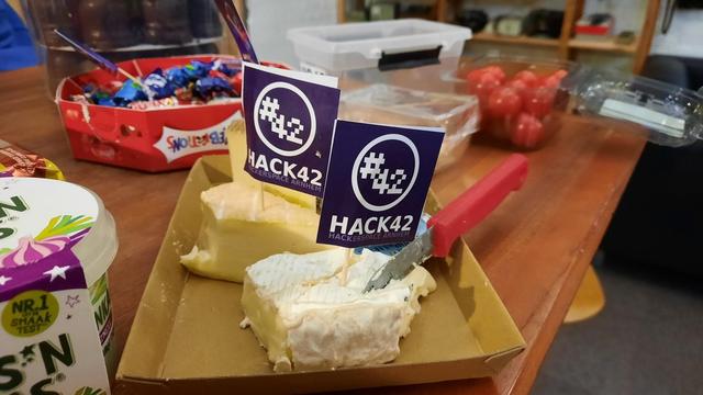 Some cheese with little Hack42 flags