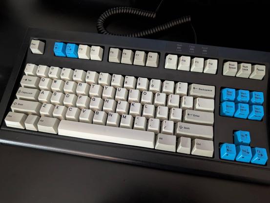 black TKL keyboard with IBM style pearl, pebble, and blue keys