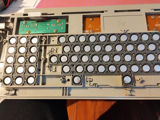 a photo shot during reassembly, all membranes have been placed into the keys, only the PCB is missing. it looks very clean and shiny now.