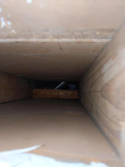 A photo taken inside of a wall, which helped us navigate some 'house bones' on order to rewire an outlet in the upstairs hallway.