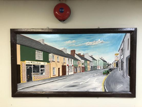 Painting of 1980's street scene of Pembroke Street Tralee Ireland by E. Cotter