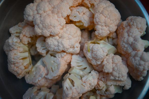 Four cauliflowers chopped up.
