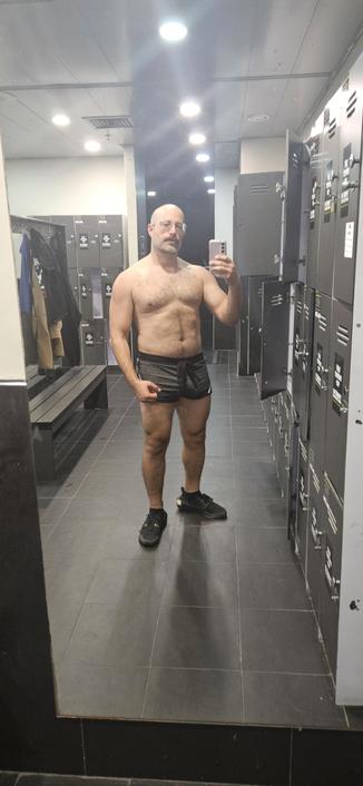Front facing mirror shot, shirt off, post gym