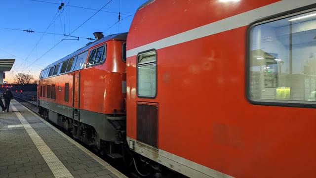 A DB class 218 hauling a Bombardier DoSto carriage in early morning.