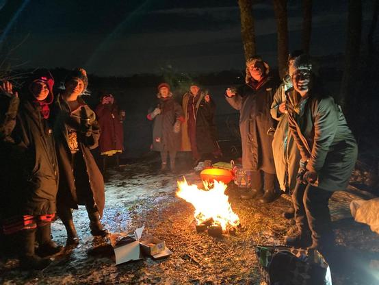 Standing around the fire post dip and fully clothed, drinking tea and eating cake.