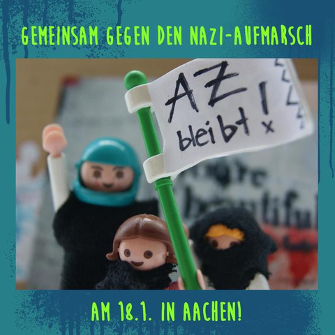 In het Duits de volgende tekst:

GEMEINSAM GEGEN DEN NAZI-AUFMARSCH

AZ bleibt!

AM 18.1. IN AACHEN