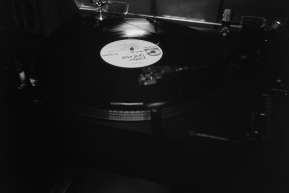 Photo of a record playing - overall underexposed as I was metering on the record label