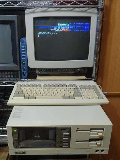 sharp mz-2500 computer, featuring a front cassette drive and dual 3.5" floppy drives