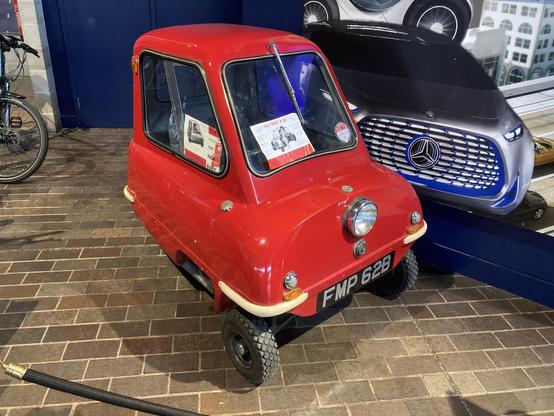 Red 1960 Peel P50, front quarter view
