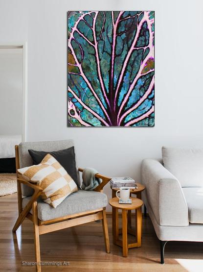 Colorful close up of a leaf in bright colors in a furniture setting by artist Sharon Cummings.