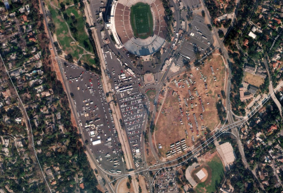 Sports stadium on top, the Rose Bowl. Many pop up tents and hundreds of fire vehicles from all over the western states parked in neat rows.