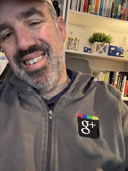 Selfie with light gray hoodie with the original Google+ logo on it. 😁