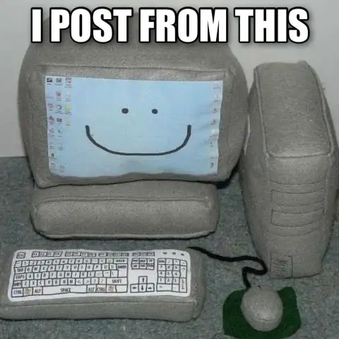 Image macro: A bunch of pillows that have printed fabric and the shapes of the various parts that constitute a desktop computer. Top text: I POST FROM THIS.