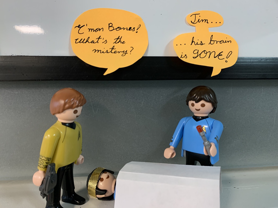 A set of 3 pieces of Star Trek Playmobil recreating the scene of STTOS S3E1 where Bones tells Kirk that Spock’s brain has disappeared.