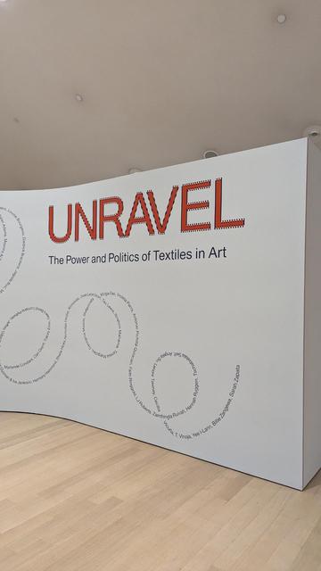 The entrance to the exhibition Unravel: The Power and Politics of textiles in art.