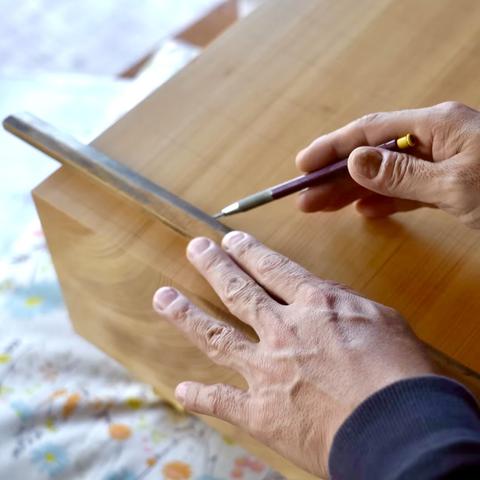Hand cut tree trunks are cured and carved into Go boards in Japan.