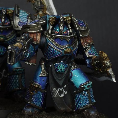Close up of a regular terminator, wearing a power axe and a volkite charger.
