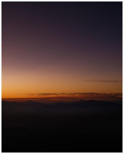 A view of mountains during sunrise