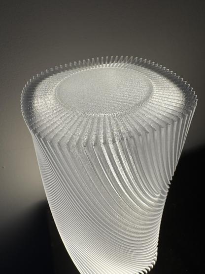 Close up of the top of a 3D printed lamp shade showing the curvy design.
