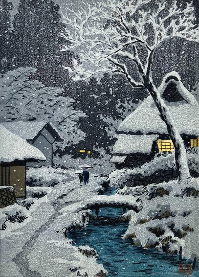 A snowy winter evening scene somewhere in rural Japan. A narrow, cold-looking creek cuts through the forground; on the right-hand bank, a tall leafless tree is plastered with snow and frost, while on the left-hand bank, a faint track worn by foot traffic in the snow runs past a couple of small buildings. A pair of figures -- one child and one adult, each carrying bamboo umbrellas -- follow the track, heading toward a snow-covered house where warm lights shine in the windows. Beyond, a shadowy forest cuts a silhouette against a dull gray sky. Snow continues falling across the scene.