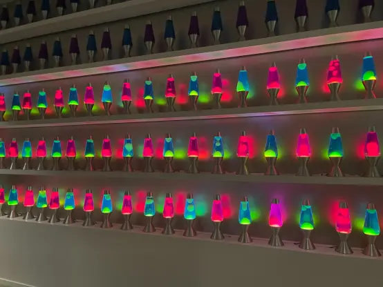 Several rows of different colour lava lamps in the Cloudflare offices