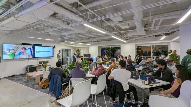 A meeting with about 40 people listening to Jason Swett @ ProductBoard HQ