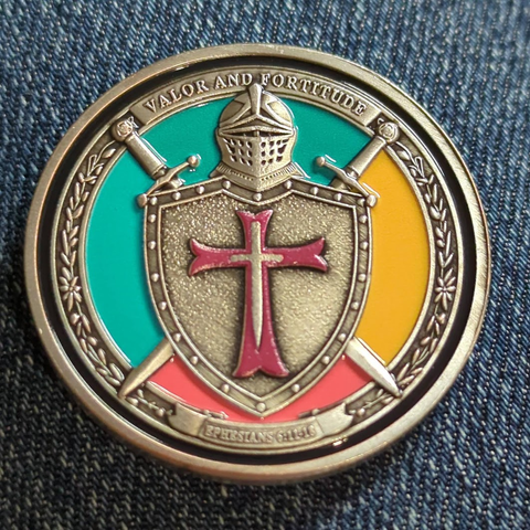 Valor and Fortitude / Cross on helmeted shield with crossed swords behind / Ephesians 6:11-18