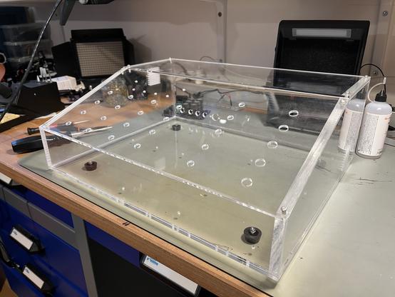 Assembled acrylic parts, inserts on the side panels to hold the top/front panel
