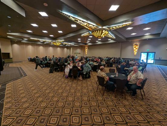 Probably 40 tables of folks playing board games.