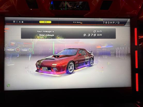 Post-session mileage screen displaying 9,379 kilometers on my red Mazda RX-7 GT-X (also known as the FC3S or FC), with the new "Wild Goose" title.