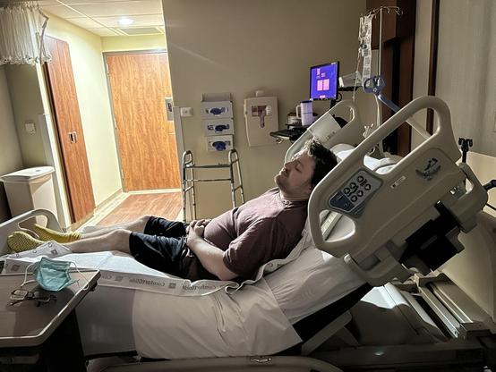 Me laying in a hospital bed on the first day after being admitted to a med surge floor. Still wearing my street clothes.