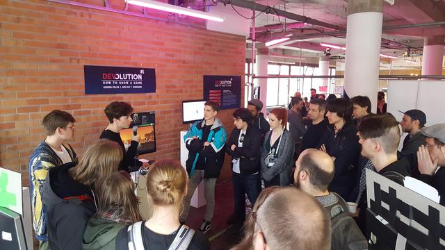 The developer Noio guiding through the Devolution exhibition of his game Kingdom.