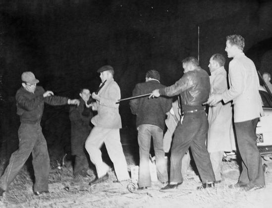 Native Lumbee fighting Ku Klux Klansmen hand-to-hand during the Battle of Maxton Field. By State Archives of North Carolina - https://www.flickr.com/photos/north-carolina-state-archives/8224422682/, No restrictions, https://commons.wikimedia.org/w/index.php?curid=54992495