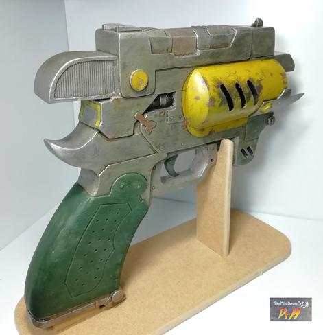 The Outer Worlds pistol prop replica on display stand from rear right.