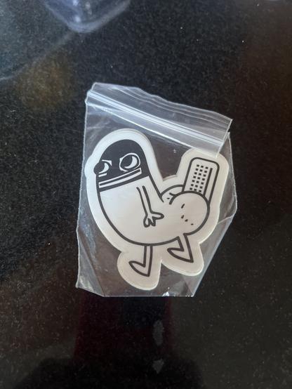 A safely sealed bag of Threatbutt stickers