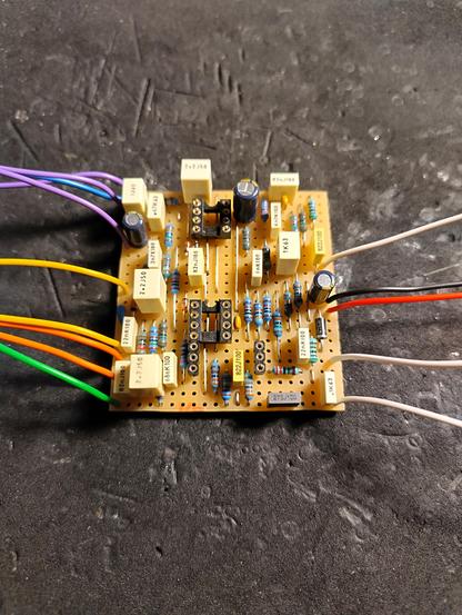 Photo of a guitar effect PCB with wires attached.