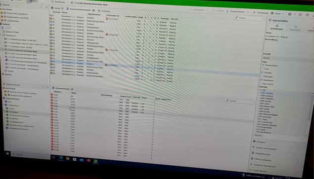 A screen displaying the ETS6 software used for programming KNX components. The interface shows a detailed table with channels, parameters, and group addresses. On the right side, there is a panel with additional settings and properties for configuration.