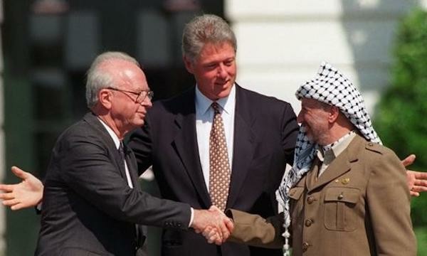 Israeli PM Yitzak Rabin, US President Clinton, Palestinian Chairman Yasser Arafat signing peace accords.