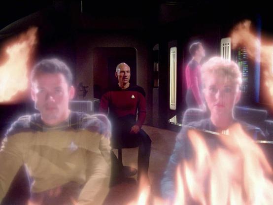 Screen capture from Star Trek: The Next Generation episode "The Battle" shows Captain Picard on the bridge of his old ship, the Stargazer, amidst semi-transparent officers from his past and semi-transparent flames.