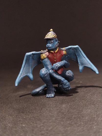 Painted miniature of a flying monkey.