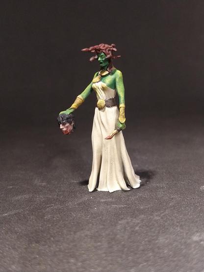 Painted miniature of a Medusa.