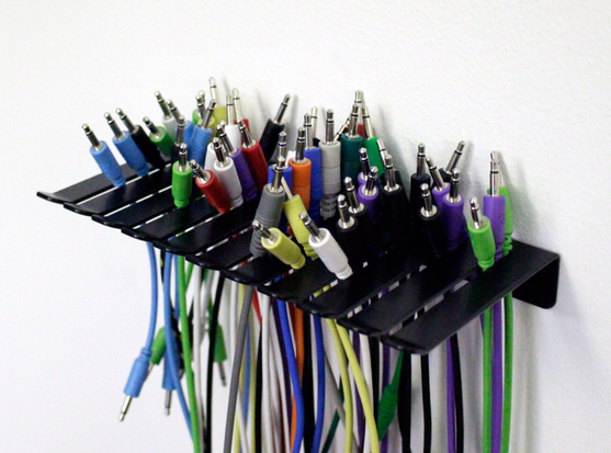 Current approach: wall mounted patch cable holder