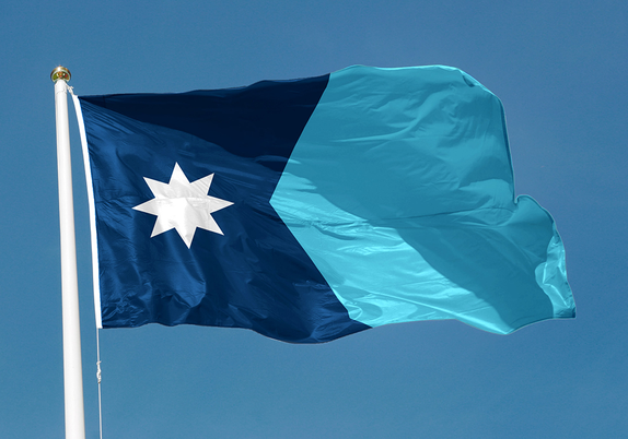 The Minnesota state flag, as described in the post, flying from a flagpole against a brilliant blue sky.