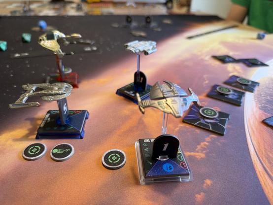 Star Trek Attack Wing in play. A Defiant class ship, a Klingon Bird of Prey, and an Akira class face off against two Dominion cruisers. It’s all about to go down and Captain Kirk is nowhere to be seen.
