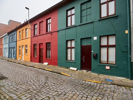 The same row of houses. Now the green house is more prominent.