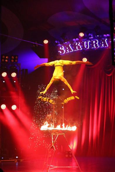 A balancing act in three parts (part two).
The young man is mid air. He has pushed the bricks that are also mid air, falling.