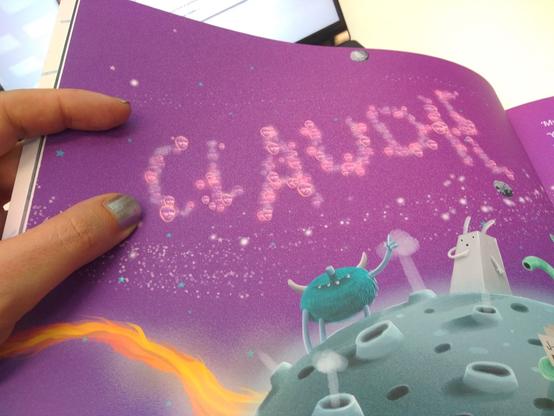 the name 'Claude' is drawn as a constellation in a galaxy in a childrens book. Rather than being built of stars, the constellation is built of particles using a texture map of the disembodied head of a bearded man wearing a cap
